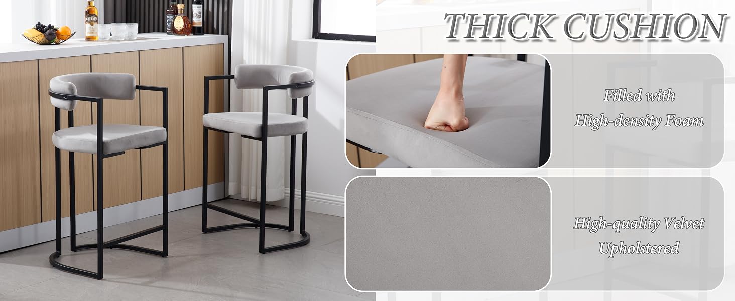 Modern bar stools with thick grey cushioned seats and black metal frames, shown in kitchen setting with demonstration of cushion thickness.