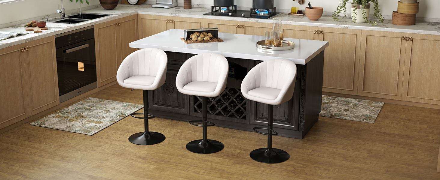 Interior view of a modern office or workspace with white bar stools at a counter and clean minimalist design.