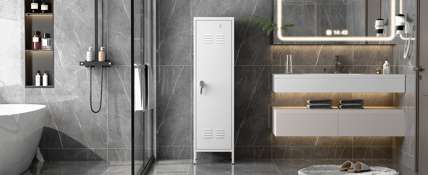 Intérieur de salle de bain moderne avec carrelage gris, comprenant une douche à l'italienne, un meuble-lavabo flottant et des solutions de rangement intégrées dans un style minimaliste.