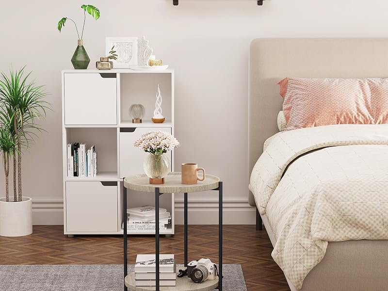 a bedroom with a bed, a planter, and a bed.