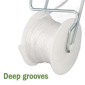 Porte-bobine en fil métallique avec matériau blanc enroulé dessus. Le texte « Deep grooves » apparaît en dessous