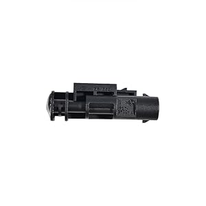 Black plastic or composite mechanical component showing detailed internal structure and mounting points.