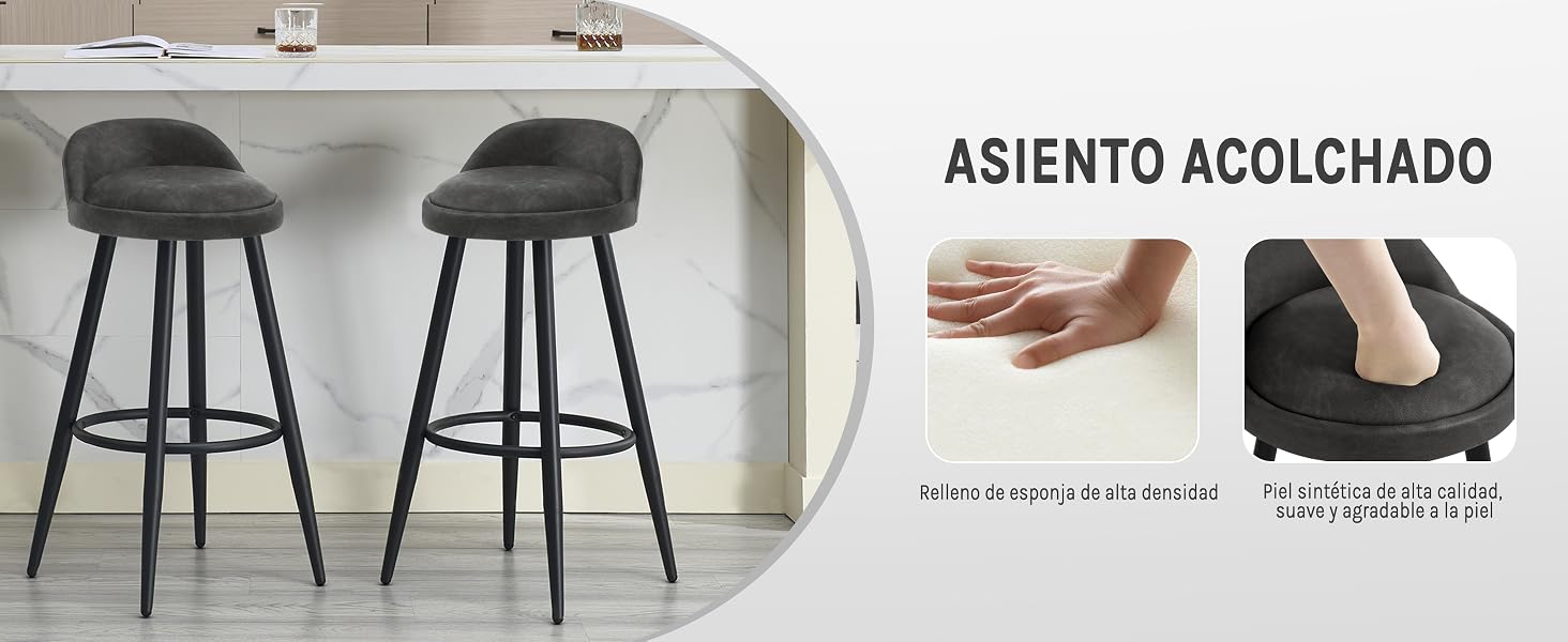 Dos taburetes de bar tapizados en gris con respaldos redondeados y patas de metal negro. Las imágenes insertadas muestran el cojín del asiento acolchado y la mano que muestran la suavidad del cojín