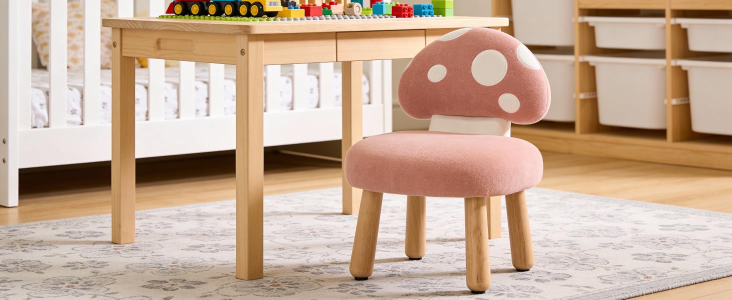 Minimalist children's play area with wooden furniture and colorful elements on a light floor, featuring simple wooden stools and chairs.