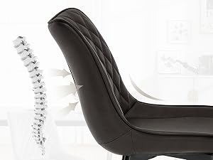 a chair with a back support being pulled up to the back.