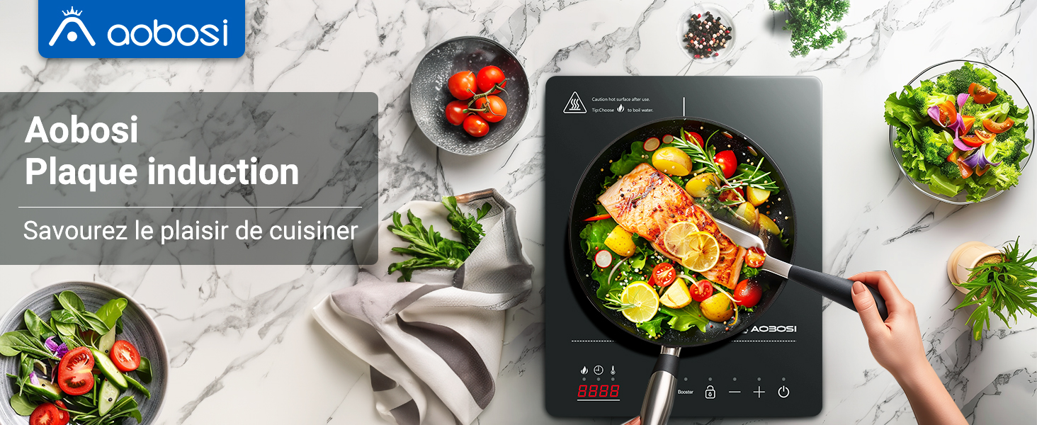de la table de cuisson à induction Aobosi montrant des salades fraîches et des scènes de cuisine sur un plan de travail en marbre avec