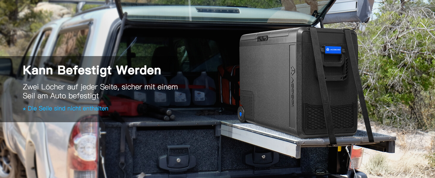 Schwarzes elektronisches Gerät, das auf der Rückseite eines Fahrzeugs montiert ist und wie eine Art mobile Computer- oder Speichereinheit aussieht.