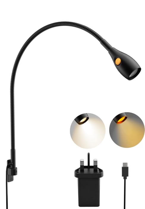 Collection of charging accessories including black cables, power adapters, and connectors displayed against a dark backdrop.