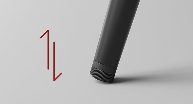 Il testo dice «Immagine 1". Vista ravvicinata di un dispositivo o componente cilindrico nero su uno sfondo grigio chiaro, con trama dettagliata e finitura superficiale.