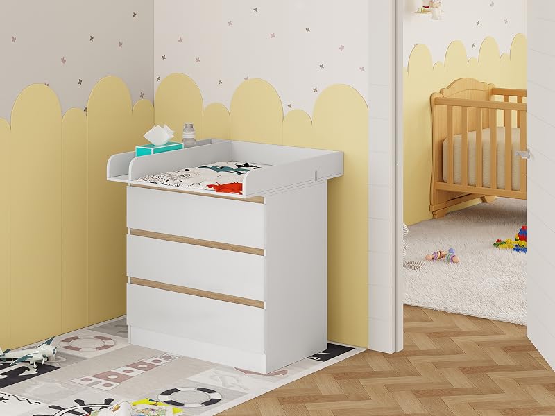 a baby changing table with a chest of drawers