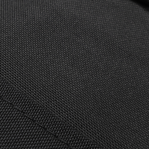 Dark charcoal gray textured fabric or material surface with uniform woven pattern, appears to be upholstery or textile sample.