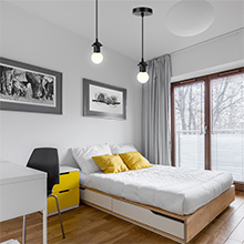 a bedroom with a bed and a desk.