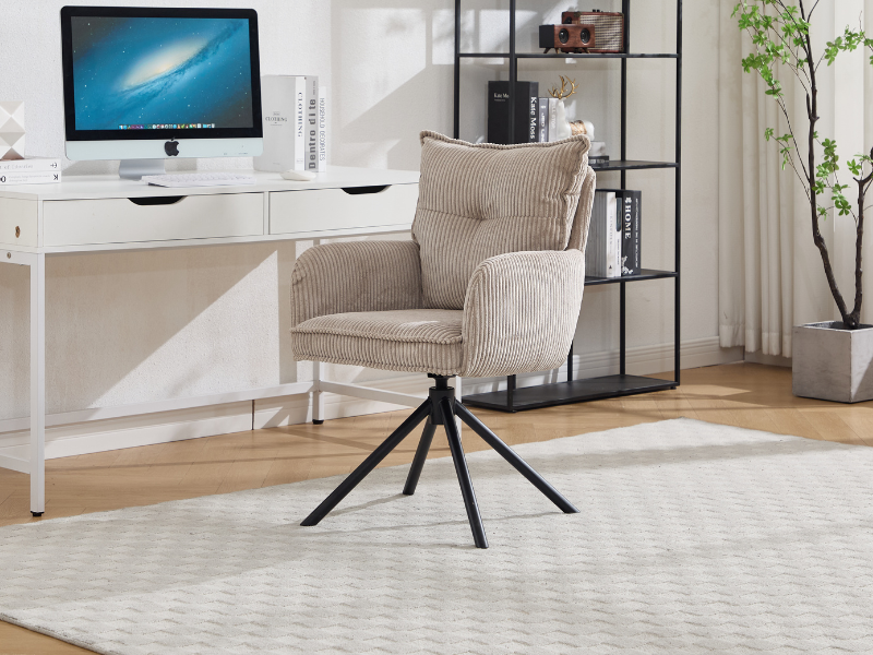 Modern home office setup with iMac computer on white desk, beige swivel chair with metal base, and decorative shelf unit against light walls with plant decor.