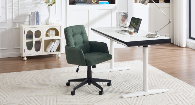 Interior office space with modern furniture including desk setup, office chair, and storage units in a bright room with natural lighting.