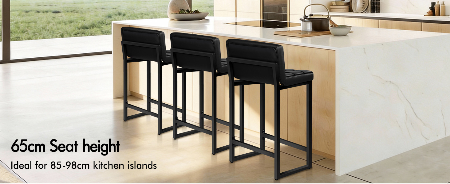 Text reads '65cm Seat height' and 'Ideal for 85-98cm kitchen islands'. Modern black bar stools with backrest against wooden kitchen island with marble countertop.