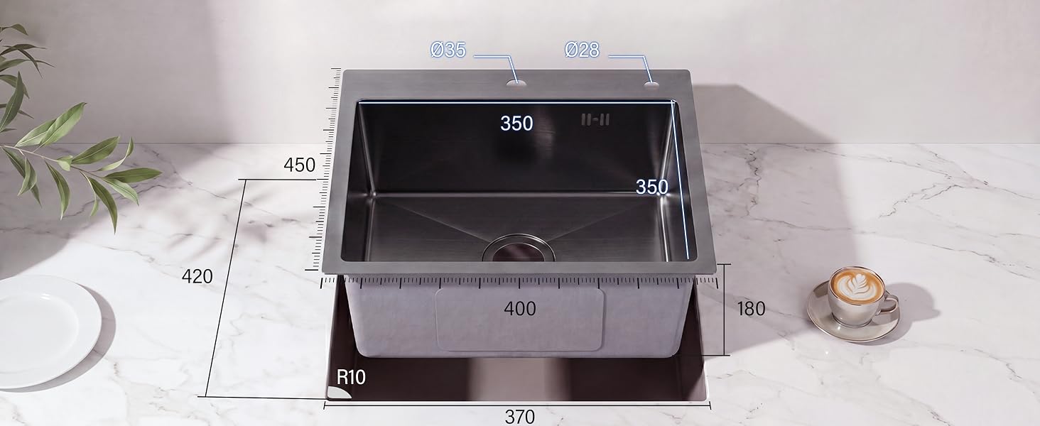 Organiseur de rangement en plastique gris avec deux compartiments et des marquages de mesure (420, 330, 160, 140 mm visibles) affichés sur une surface en marbre blanc avec des plantes décoratives et de petits objets.