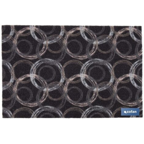 Felpudo de entrada con diseño de círculos en tonos oscuros 50x70cm fabricado en poliéster y PVC con base antideslizante