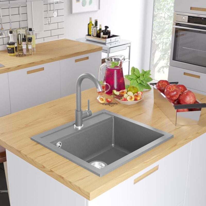 

Fregadero de cocina de granito con un seno gris