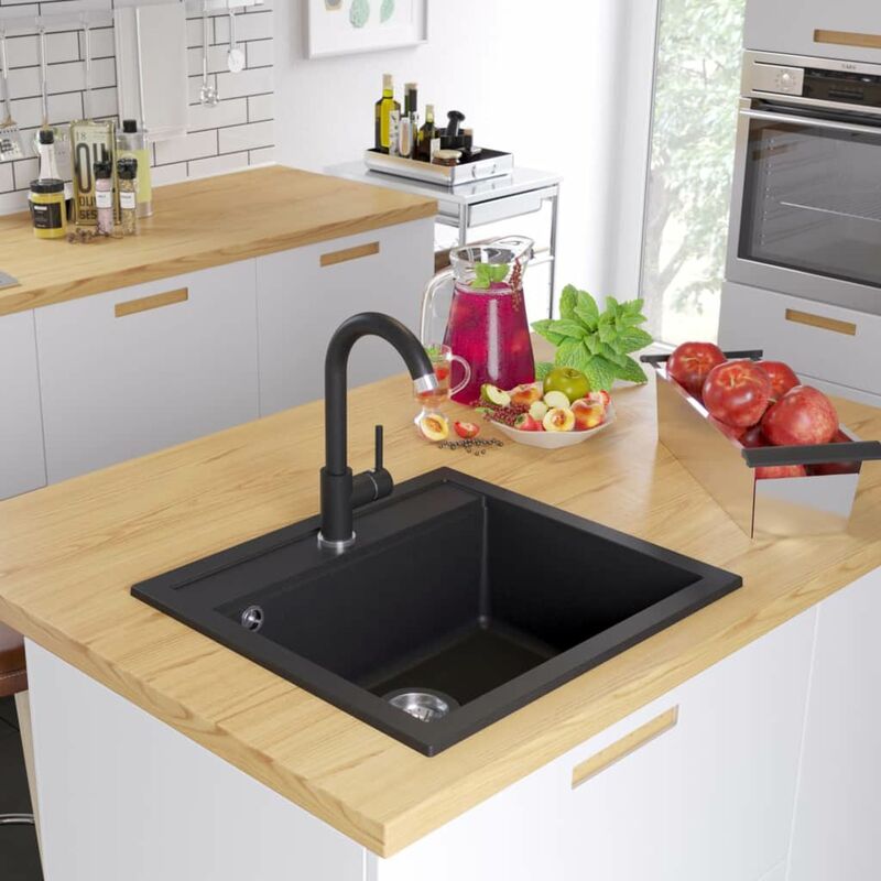 

Fregadero de cocina de granito con un seno negro