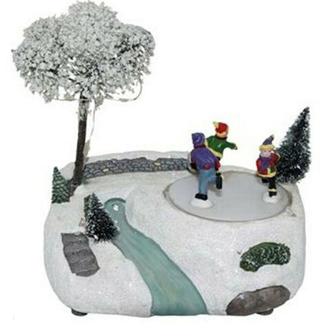 Giostra giostrina innevata bambini pattinatori decorazioni natalizi luci suoni movimento