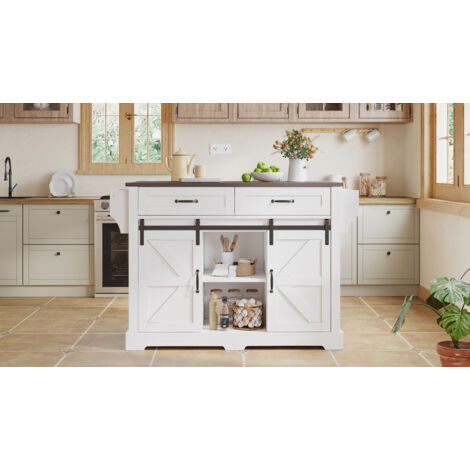 Îlot de cuisine avec plan de travail réglable, meuble de cuisine sur roulettes. Armoire à cuisine doté de 2 portes coulissantes et de 2 tiroirs. Style rustique, en blanc.