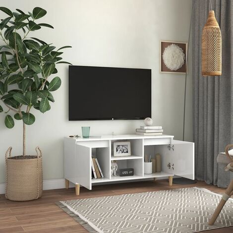 Armoire télévisée avec des jambes en bois clair équipées de 2 portes et de divers compartiments de couleurs Couleur : Blanc brillant