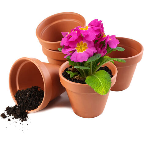 Les pots de fleurs encastrés au jardin  Pot de fleurs, Pots de fleurs  décorés, Pot de fleurs en argile