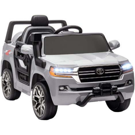AIYAPLAY coche eléctrico para niños de +3 años Toyota LAND CRUISER con batería 12V mando a distancia faros bocina arranque suave y música MP3 gris (1/5)