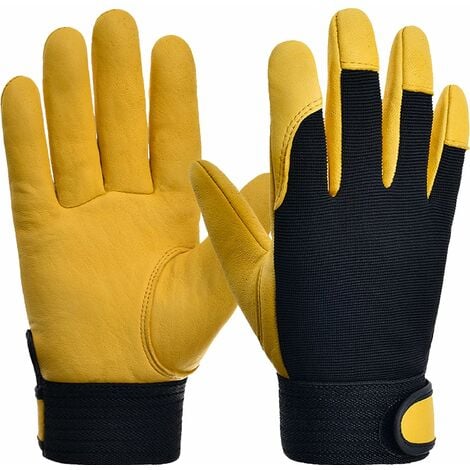 Gros plan de l'homme tenant des gants de travail jaunes 1227893