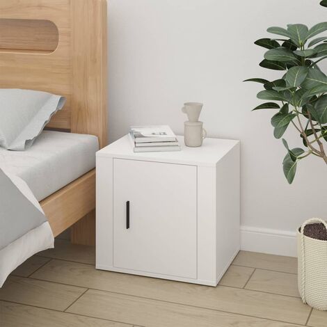 Un comodino bianco scanalato con un cassetto e un ripiano