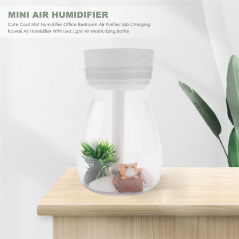 humidificateur avec des plantes à la maison sur la table dans la