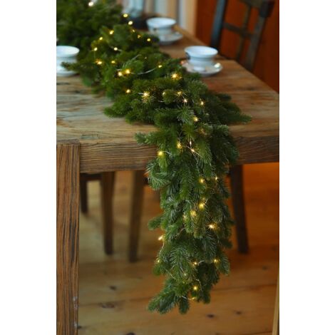 Guirlande de Noël 6FT LAOA Guirlande de pin avec guirlande lumineuse LED 9.8FT, plante de verdure pour décorations de Noël Table Manteau Fond Mur Chambre Extérieur Intérieur Décoration d'hiver (1/5)