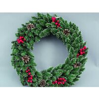 Couronne de Noël verte derrière la porte avec des pommes de pin 50 cm