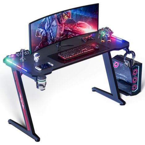 WeValley Bureau Gaming LED, 140 x 60cm Grande Bureau Gamer avec Un Plateau en Fibre de Carbone, Bureau Informatique Ergonomique avec Tapis de Souris, Porte-gobelet et Crochet pour Casque, Noir