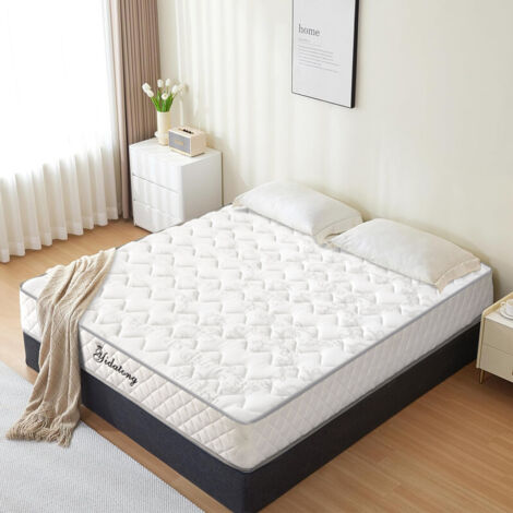 Matelas 140x190cm, 26 cm d'épaisseur, avec une structure mixte de ressorts ensachés indépendants et de mousse à mémoire de forme, moyennement souple et dure, et propice au sommeil