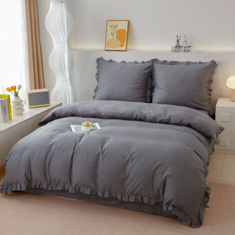 Juego de ropa de cama de algodón premium de 140x200 cm con volantes grises.