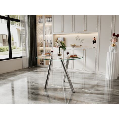 Mesa de comedor redonda de cristal templado con una estructura metálica plateada estable y fácil de limpiar. (1/5)