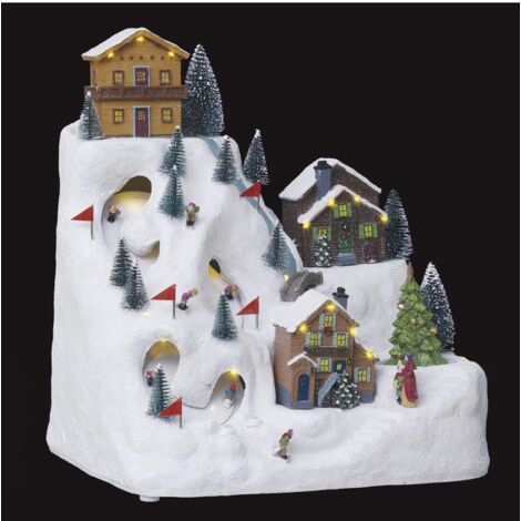 Fééric Lights And Christmas – Village de Noël lumineux avec 24 LED multicolores – Piste de ski et chalet H.34,5cm – Alimentation sur prise 220-240V