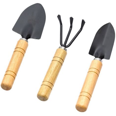 Trois outils de jardinage noirs pour planter des légumes, des fleurs et ameublir la terre une petite pelle pour les plantes en pot. (1/5)