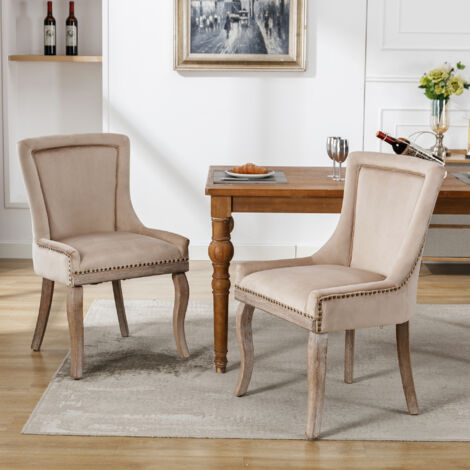 Juego de 2 sillas de comedor con ribete claveteado, patas en madera maciza, tejido en terciopelo beige
