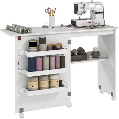 Table de couture pliante blanche à abattant, avec bacs de rangement, étagère ouverte et roulettes, meuble pratique pour atelier créatif, rangement facile et gain de place. (1/5)