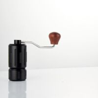 Manual coffee grinder with conical stainless steel burrs, aircraft-grade aluminum body, double bearing, adjustable