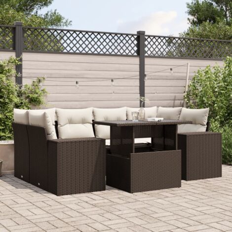 Ensemble de salon de jardin en résine tressée marron 7 pièces avec coussins crème, tables et assises modulables. (1/5)