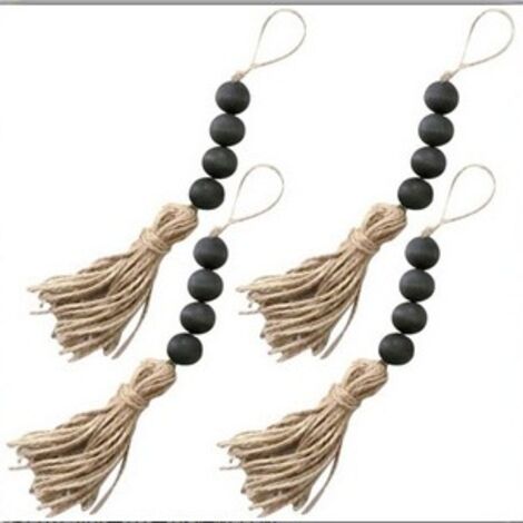 Perles de bois noir avec pompons en corde de chanvre, un objet de décoration pour l'intérieur et l'extérieur. (1/5)