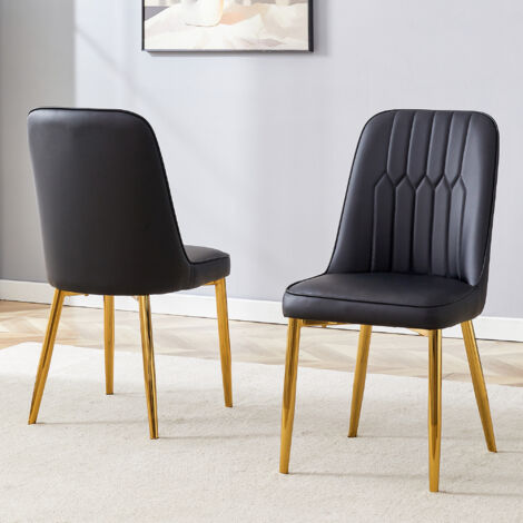 Deux chaises en cuir noir pour la salle à manger : design moderne et minimaliste. Ces chaises sont équipées de sièges larges, d’accoudoirs et de pieds métalliques antidérapants. (1/5)