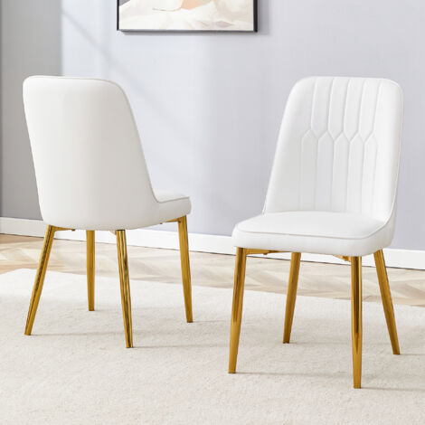 Deux chaises en cuir blanc pour la salle à manger : design moderne et minimaliste. Ces chaises sont équipées de sièges larges, d’accoudoirs et de pieds métalliques antidérapants. (1/5)