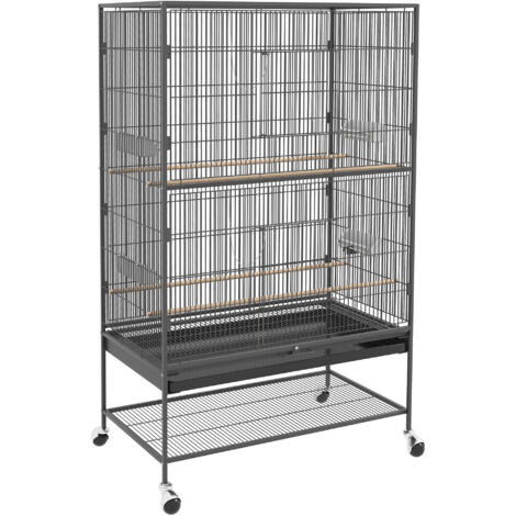 Cage pour oiseaux, avec des poteaux de sécurité et un plan de travail. Dimensions : 94 x 57 x 153 cm. Couleur gris. La cage est équipée de portes et de roulettes permettant aux oiseaux de se déplacer (1/5)