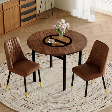 Set de table ronde et minimaliste moderne (comprenant 2 fauteuils en tissu marron avec pieds métalliques noirs). La table est ronde, avec un diamètre de 100 cm. Elle est conçue dans un style boisé. (1/5)