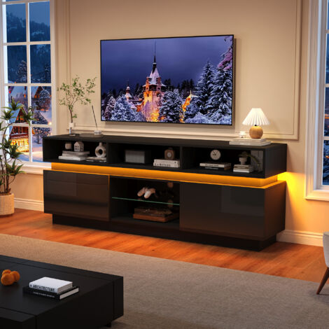 Pouvoir de 1603560 cm pour le montage du téléviseur dans le salon. Support plat pour le téléviseur, avec un espace de rangement en verre durci. Meuble basique, à la finition brillante.Couleur noire. (1/5)