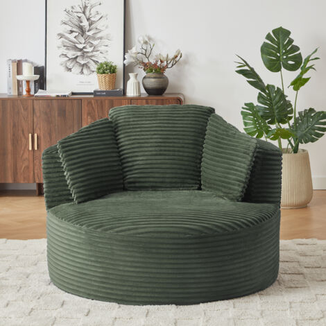 Sillón redondo de pana verde, asiento profundo con espuma de alta densidad y muelles ensacados, sin montaje